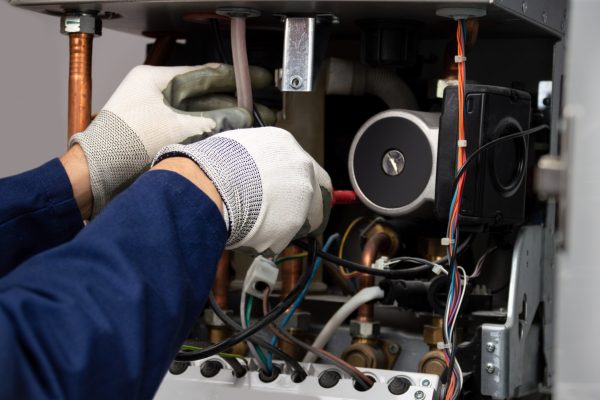 Cropped,Shot,Of,An,Unrecognizable,Male,Boiler,Technician,Repairing,A